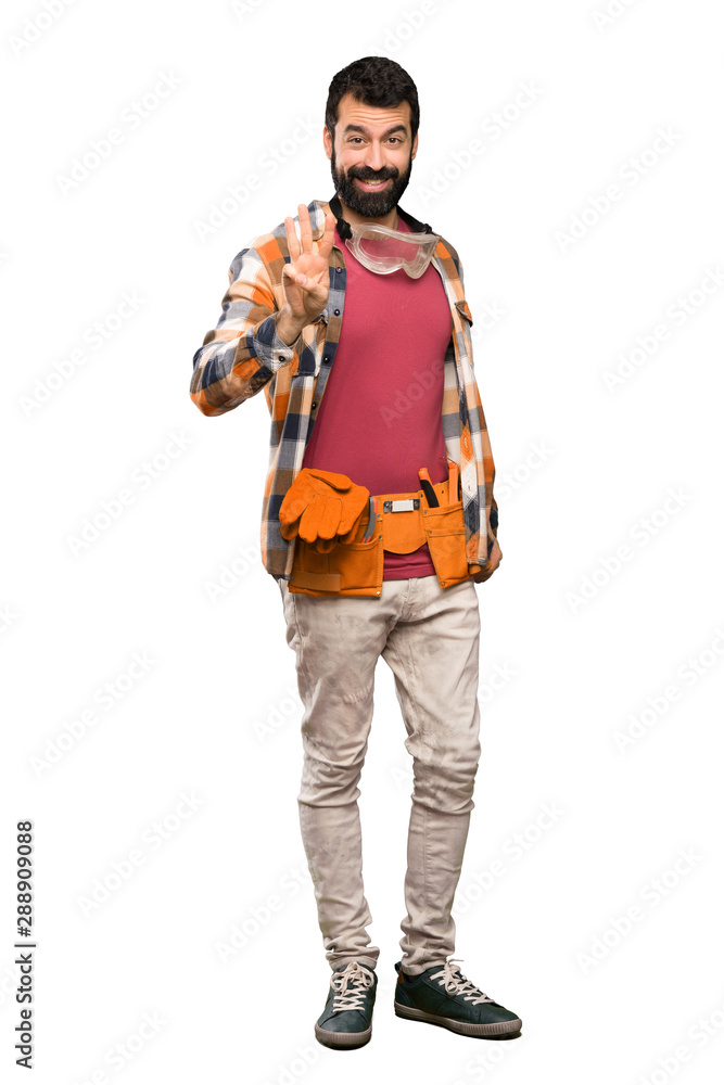 Craftsmen man happy and counting three with fingers over isolated white background Craftsmen man happy and counting three with fingers over isolated white background