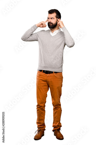 Handsome man having doubts and thinking over isolated white background