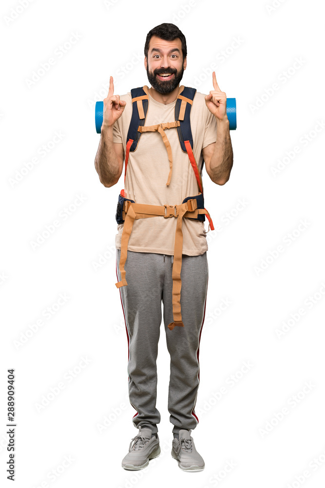 Hiker man pointing up a great idea over isolated white background Hiker man pointing up a great idea over isolated white background