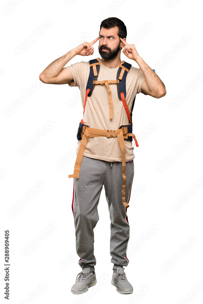 Hiker man having doubts and thinking over isolated white background Hiker man having doubts and thinking over isolated white background