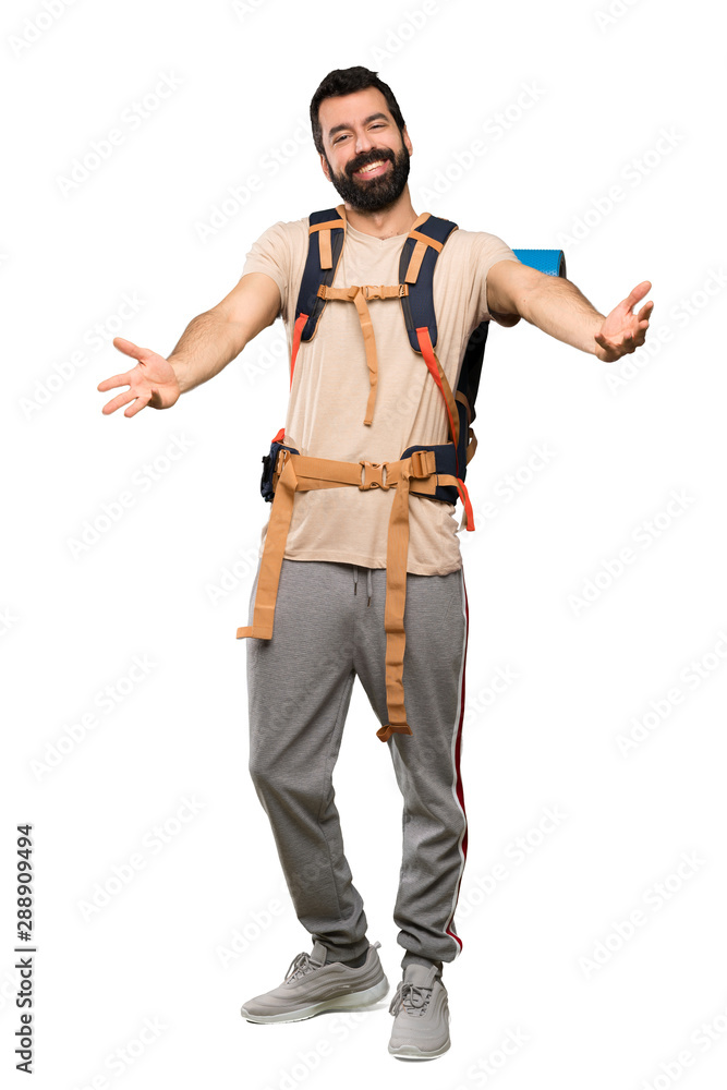 Hiker man presenting and inviting to come with hand over isolated white background Hiker man presenting and inviting to come with hand over isolated white background