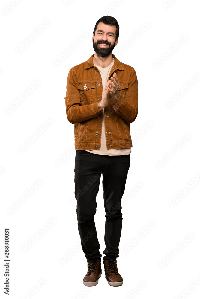 Handsome man with beard applauding after presentation in a conference over isolated white background Handsome man with beard applauding after presentation in a conference over isolated white background
