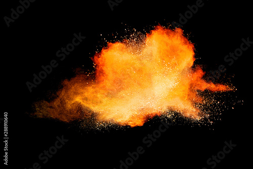 Abstract orange powder explosion isolated on white background.