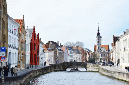 Bruges, Belgium. Image with Rozenhoedkaai in Brugge, Dijver river canal twilight and Belfort (Belfry) tower.
