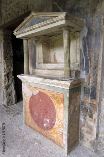 Closeup of the well preserved Lararium of the House of the Golden Cupids in Pompeii, Italy, Europe
