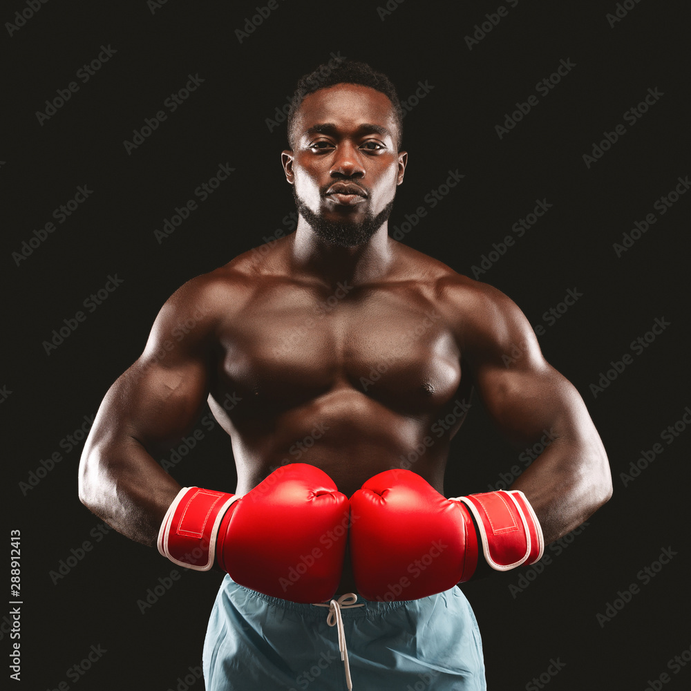 Portrait of serious african boxer ready to fight