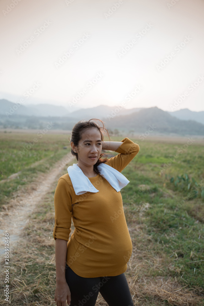 active asian pregnant woman workout outdoor active asian pregnant woman workout outdoor