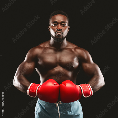 Portrait of serious african boxer ready to fight