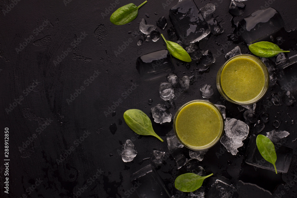 Summer healthy cocktails in glasses on black background Summer healthy cocktails in glasses on black background