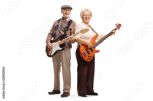 Elderly man and woman playing electric guitars © Ljupco Smokovski
