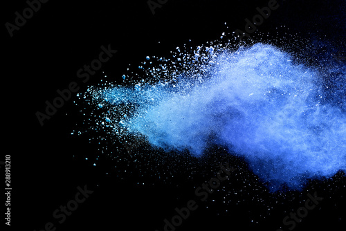 Blue sky color powder explosion on black background.