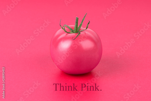 tomato on pink background