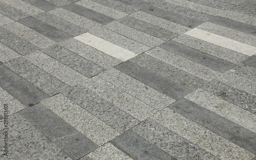 Pavement of miscellanous gray cobblestones photo