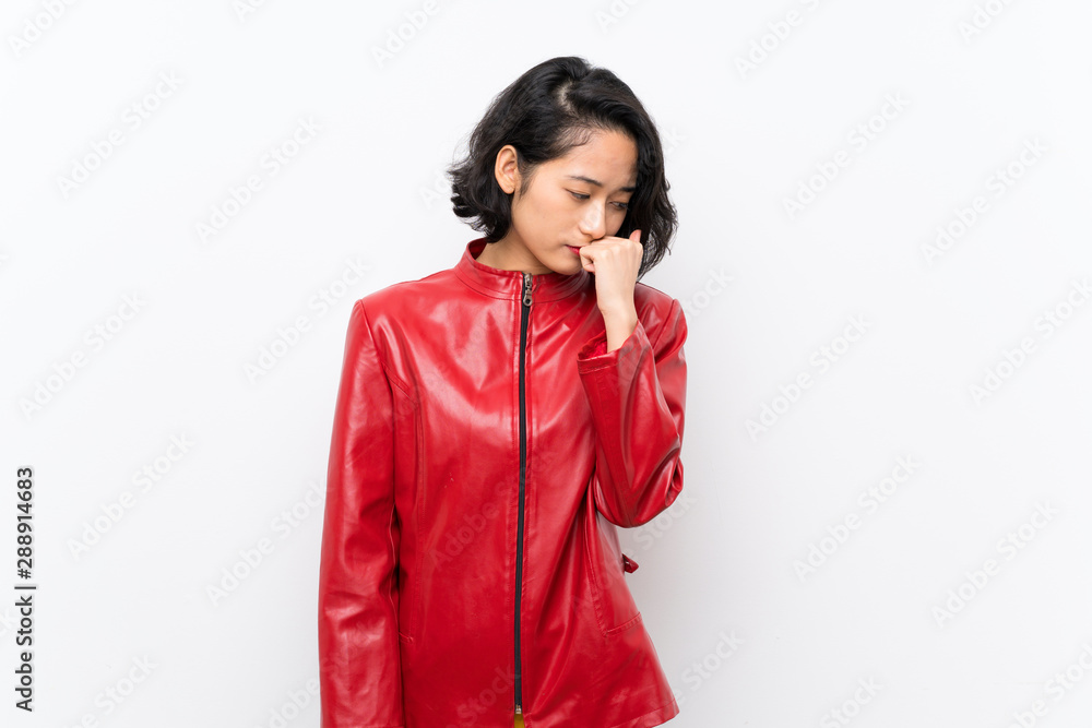 Asian young woman over isolated white background having doubts Asian young woman over isolated white background having doubts