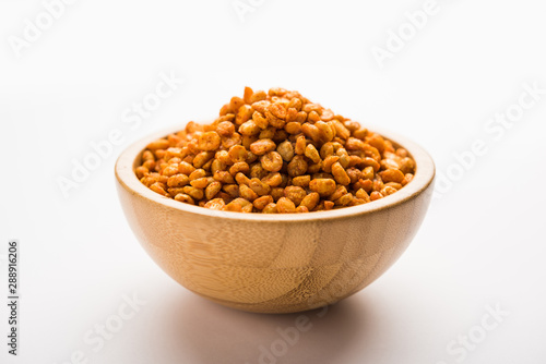 Fried and Spicy Chana Dal Masala is a popular Chakna recipe. served in a bowl. selective focus