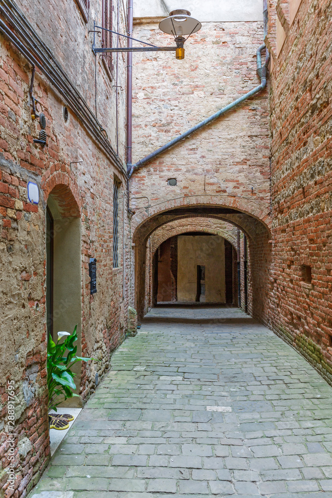 Old alley with brick walls