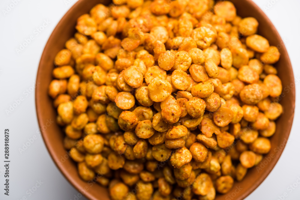 Fried and Spicy Chana Dal Masala is a popular Chakna recipe. served in a bowl. selective focus