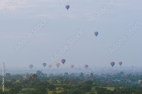 Hot-Air Balloons and Pagodas at misty Old Bagan, Myanmar