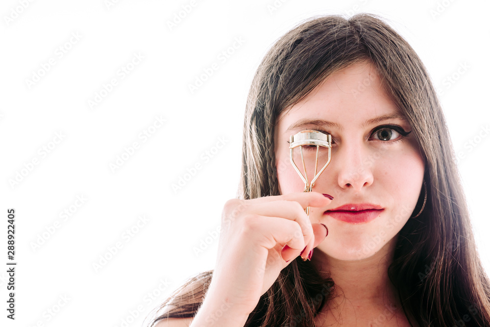 17 year old teenage girl fixing her eyelashes 17 year old teenage girl fixing her eyelashes