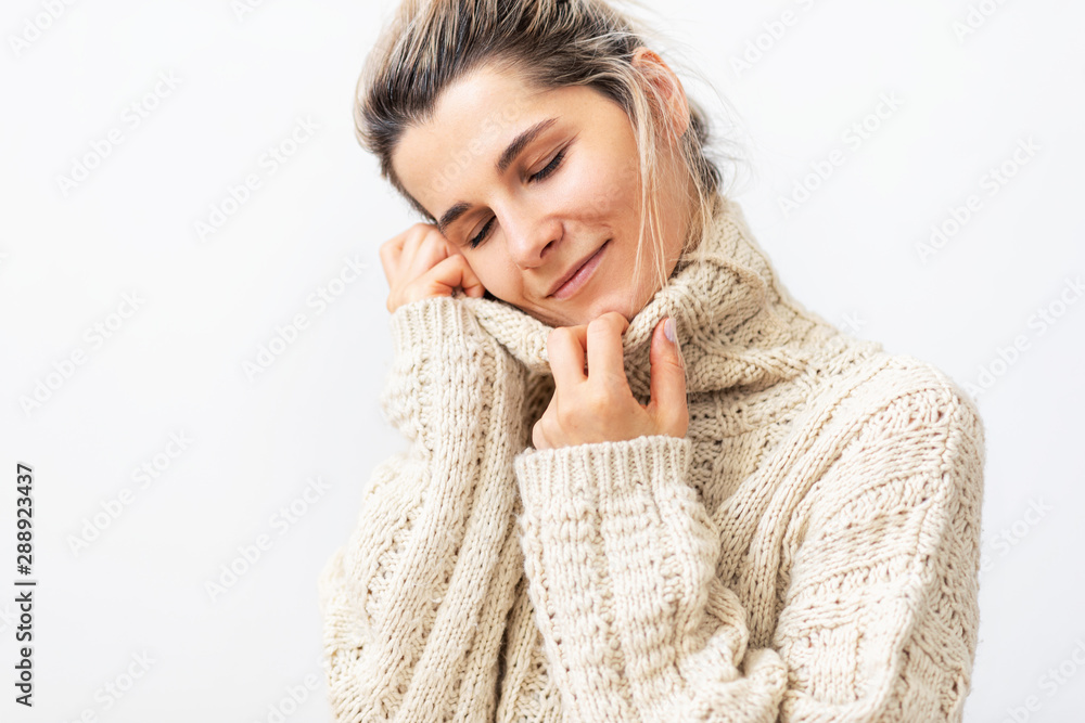 Image of charming young woman with dreaming expression with closed eyes, smiling from love and joy, over white background. Blonde female taking the rest at home. Image of charming young woman with dreaming expression with closed eyes, smiling from love and joy, over white background. Blonde female taking the rest at home.