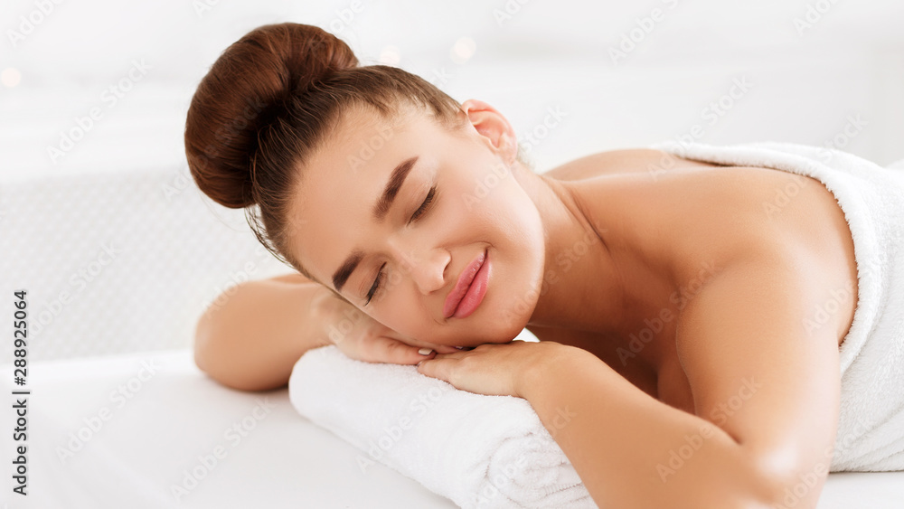 Woman lying with closed eyes, relaxing in spa Woman lying with closed eyes, relaxing in spa