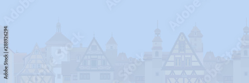 pale background of European city with half-timbered houses