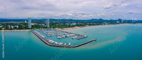 Aerial panorama view of Harbor ocean marina yachts club in Pattaya city of Thailand © Panwasin