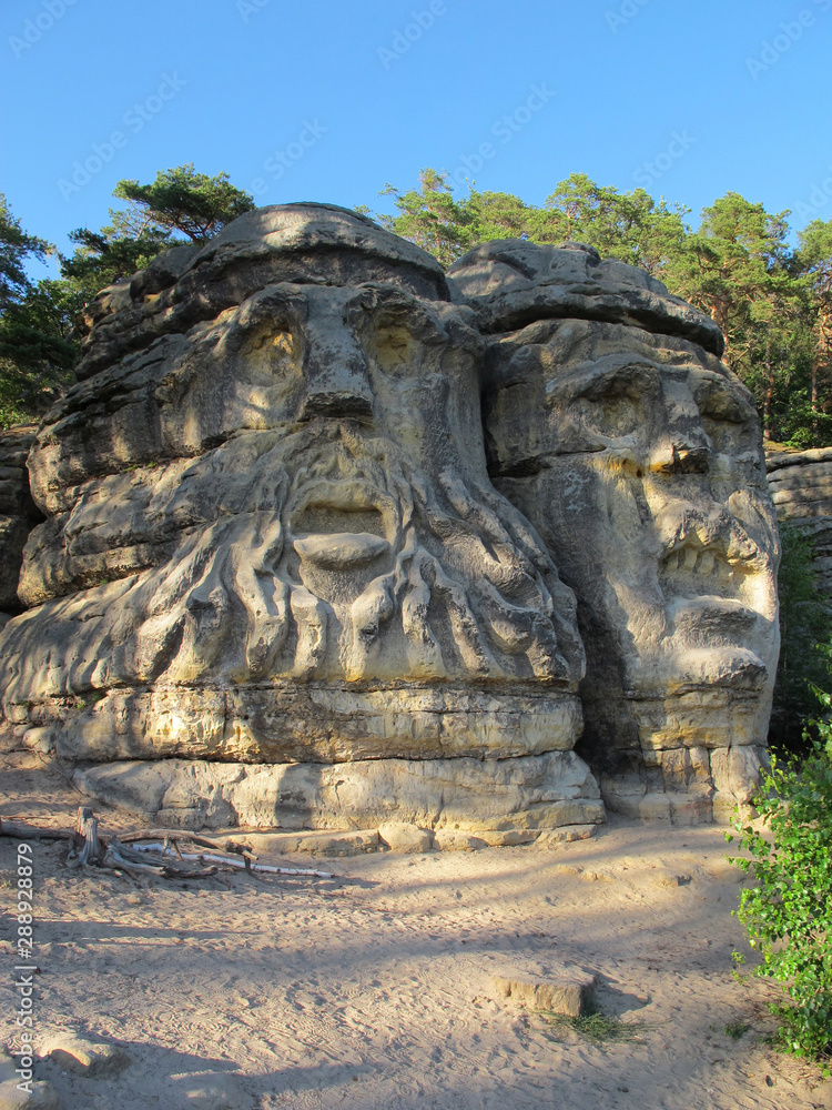 Sandstone rock formation Devils heads (Certovy hlavy) near Zelizy village. Czech Republic