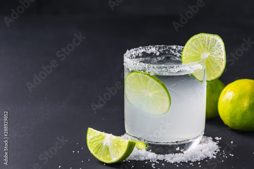 Bild auf Leinwand close-up of ice homemade lemonade with lime and salt on black table