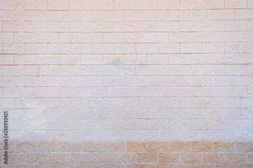 White brick wall with a rough texture.