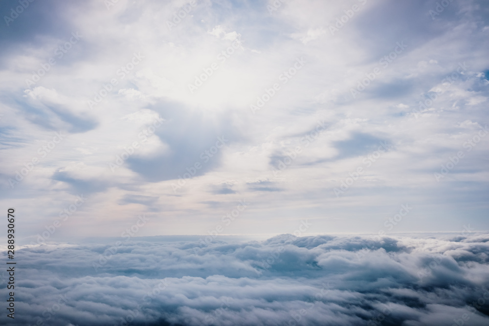 Awesome view on top of the clouds on a cloudy morning.