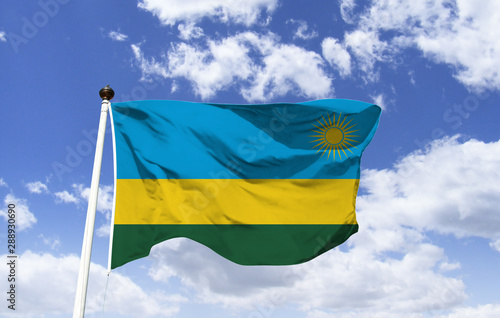 Rwanda Flag Template floating under the blue sky. East African Country. The famous Volcano National Park covers Mount Karisimbi. In the southwest, Nyungwe National Park. Capital: Kigali photo