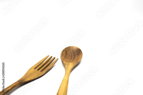 spoon and fork wooden isolated on white background with selective focus.