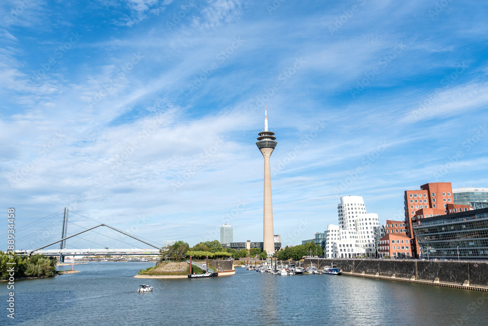 panoramic view of the Medienhafen (Media Harbour) Düsseldorf with rhine in the foreground