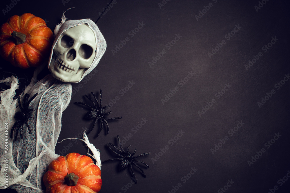 horror spooky funny ghost in halloween pumpkin holiday season greeting night celebration party with toy prop decoration in top view flatlay and trick of treat festival concept