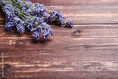 Fototapeta Naklejka Na Ścianę i Meble -  Lavender flowers on brown wooden table