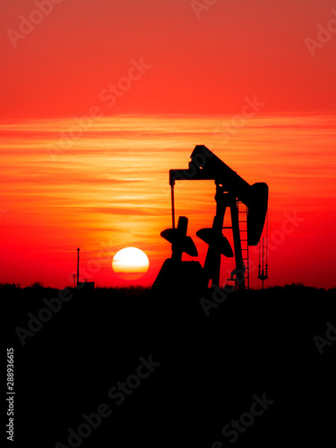 Oil pumpjack at sunset.