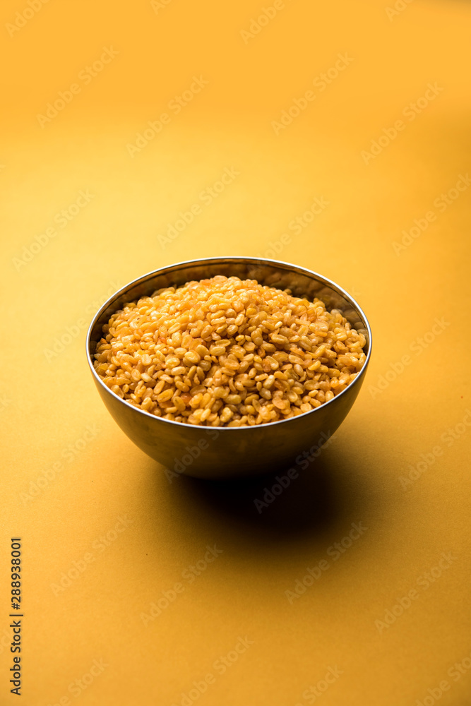 Salty and Fried Moong Dal Namkeen served in a bowl, selective focus Salty and Fried Moong Dal Namkeen served in a bowl, selective focus