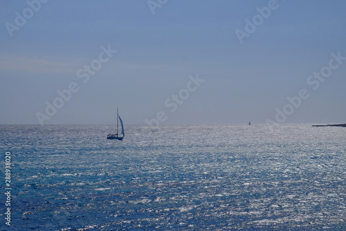 Beautiful view on the sea and sailboat on Menorca, Balearic Islands.