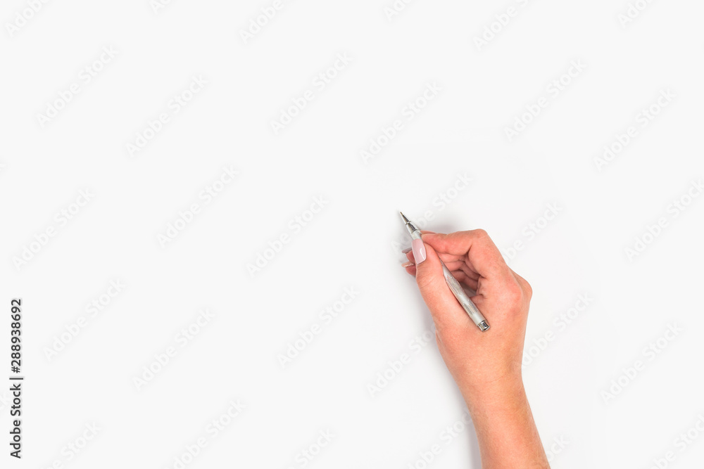 Female hand is ready for drawing with pen on white background