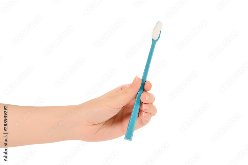 Woman holds toothbrush with toothpaste in her hand isolated on white background. Woman holds toothbrush with toothpaste in her hand isolated on white background.