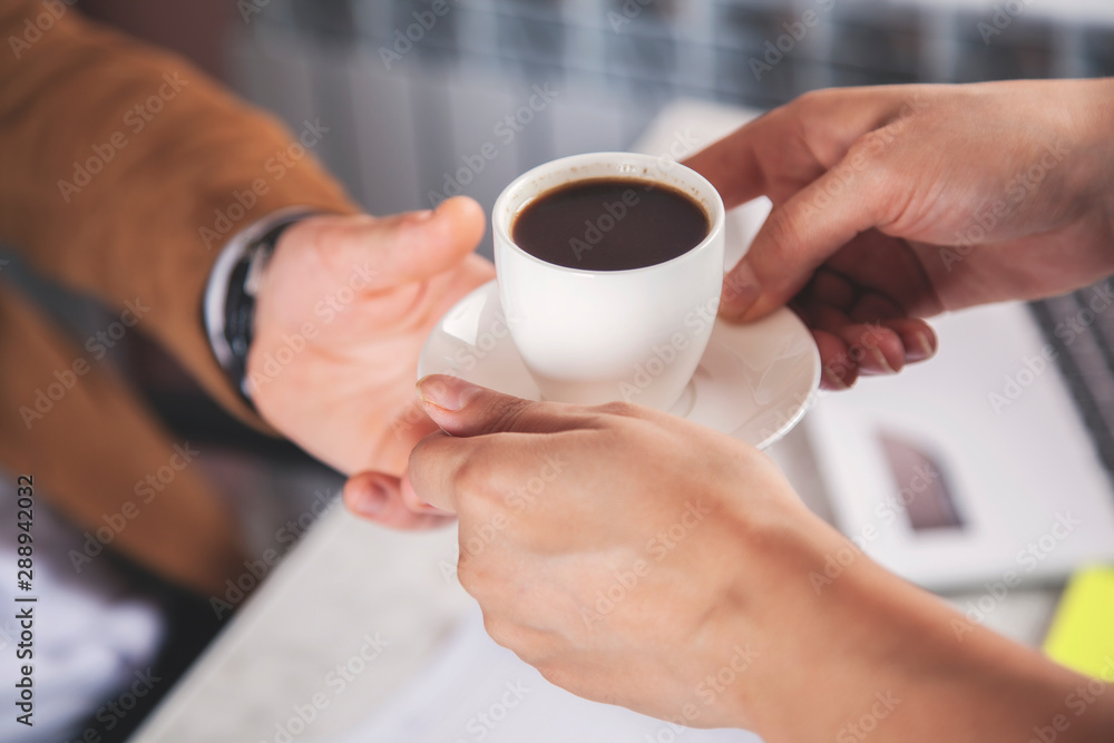 woman and boss hand coffee woman and boss hand coffee