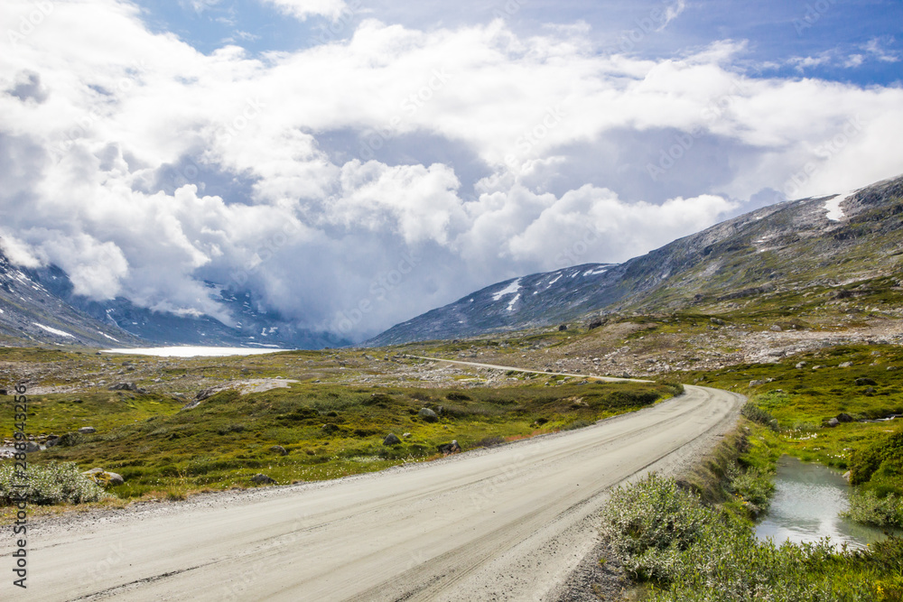 storm clouds over mountain road in Norway