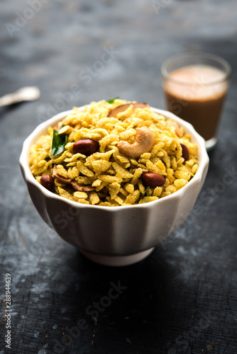 Jada Poha Namkeen Chivda / Thick Pohe Chiwda is a jar snack with a mix of sweet, salty and nuts flavours, served with tea. selective focus © Arundhati