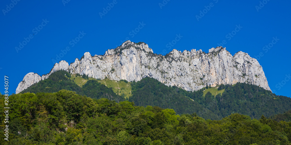 Fototapeta premium The Dents de Lanfon, a mountain in south-eastern France rising to 1824 m. Situated above Talloires on the east bank of Lake Annecy in Haute-Savoie departement of France