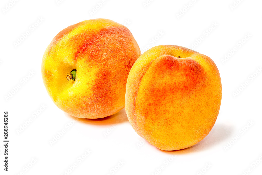Two juicy peaches. Summer fruits. Harvest on the farm. Delicious igridient for juice. White background. Two juicy peaches. Summer fruits. Harvest on the farm. Delicious igridient for juice. White background.