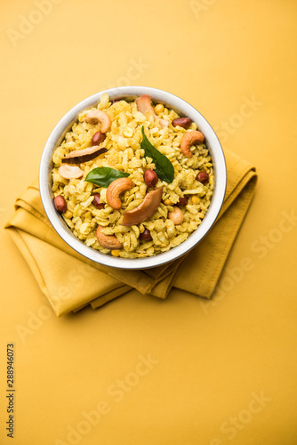 Jada Poha Namkeen Chivda / Thick Pohe Chiwda is a jar snack with a mix of sweet, salty and nuts flavours, served with tea. selective focus photo