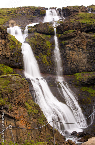 Long exposure photo of waterfall  view of the Hengifoss waterfall in Iceland  Europe.