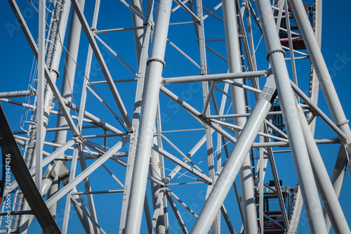 Ferris Wheel Over Blue Sky.