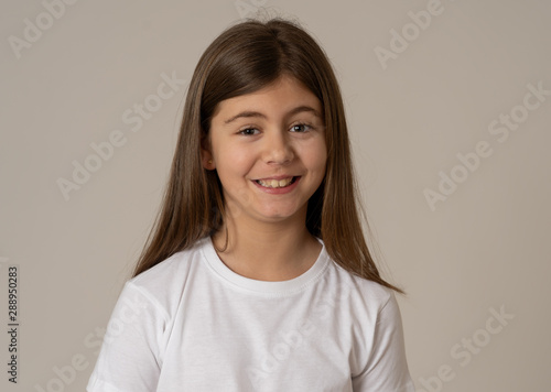 Portrait of a beautiful clever child with a happy  cheerful face looking confident. Human emotions